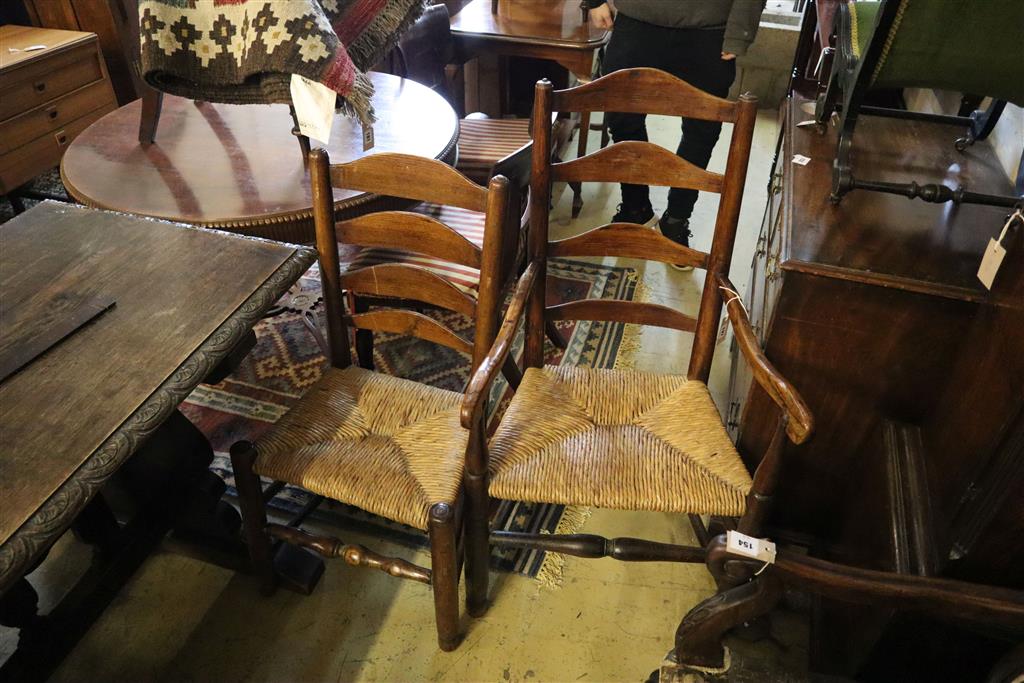 A set of eight rush seat ladderback dining chairs (two with arms)